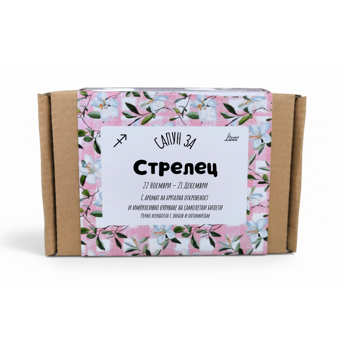 a cardboard box with a floral pattern and text in Cyrillic script.