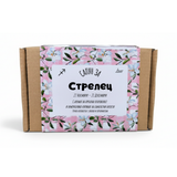 a cardboard box with a floral pattern and text in Cyrillic script.