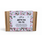 a cardboard box with a floral pattern and text in a foreign language.