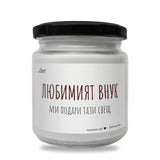 a white jar with a black lid on a white background