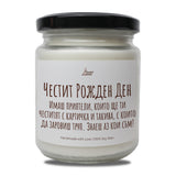 a jar of white candles sitting on top of a table