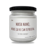 a white jar with a black lid on a white background