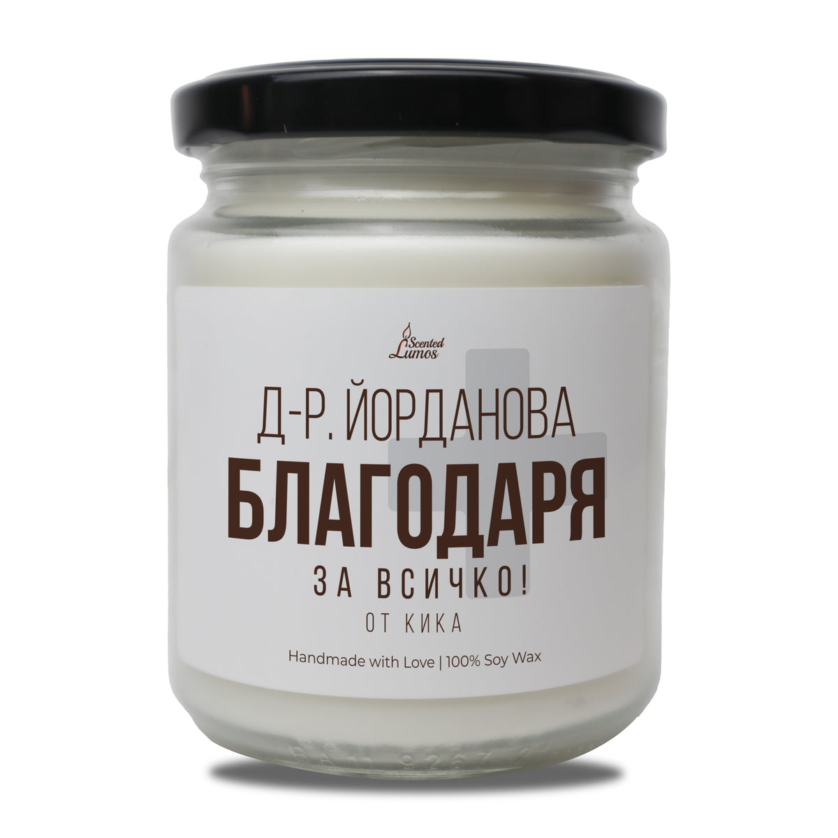 a jar of white candle sitting on top of a table