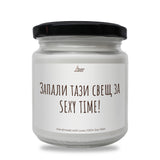 a white jar with a black lid on a white background