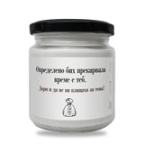 a white jar with a black lid on a white background