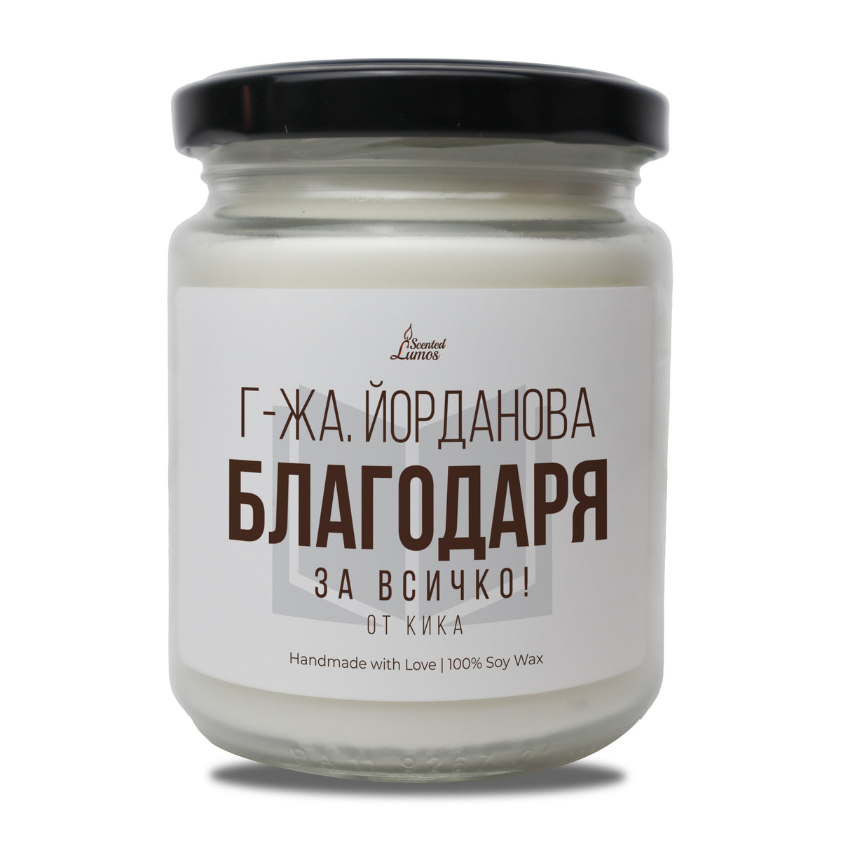 a jar of white candle sitting on top of a table