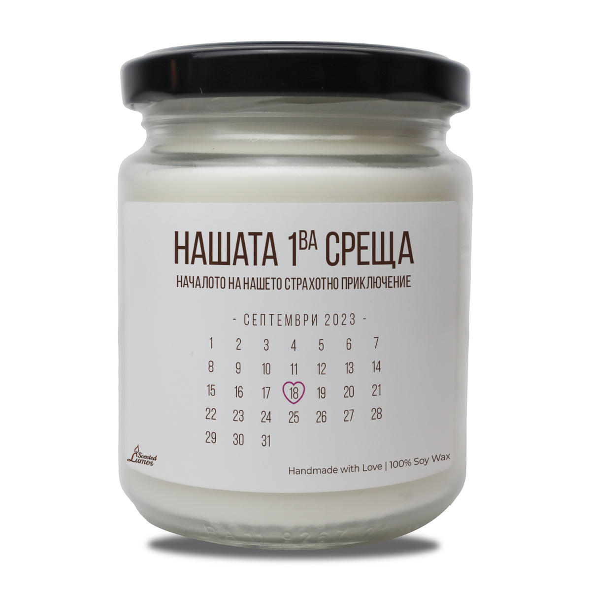 a jar of white candle with a black lid