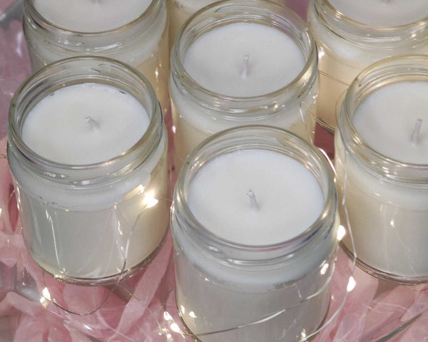 a close up of many small candles on a table