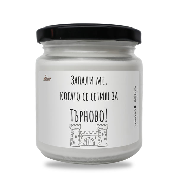 a jar of white candles with a black lid