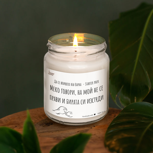 a white candle sitting on top of a wooden table