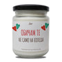 a jar of white candle with hearts on it