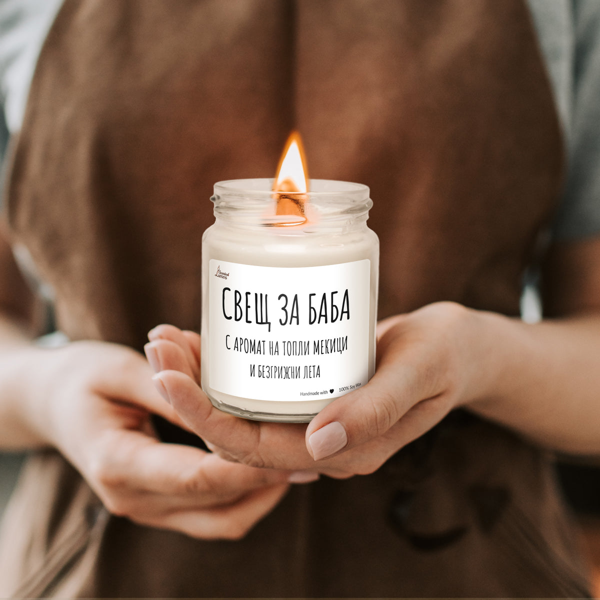 a woman holding a candle in her hands