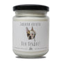 a jar of white candle with a dog on it