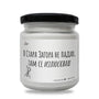a white jar with a black lid on a white background