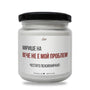 a jar of white powder on a white background
