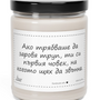 a jar of white candle with a black lid