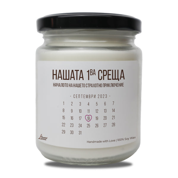 a jar of white candle with a black lid