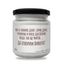 a white jar with a black lid on a white background