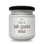 a jar of white paint on a white background