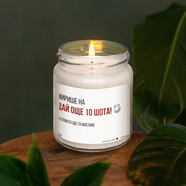 a white candle sitting on top of a wooden table